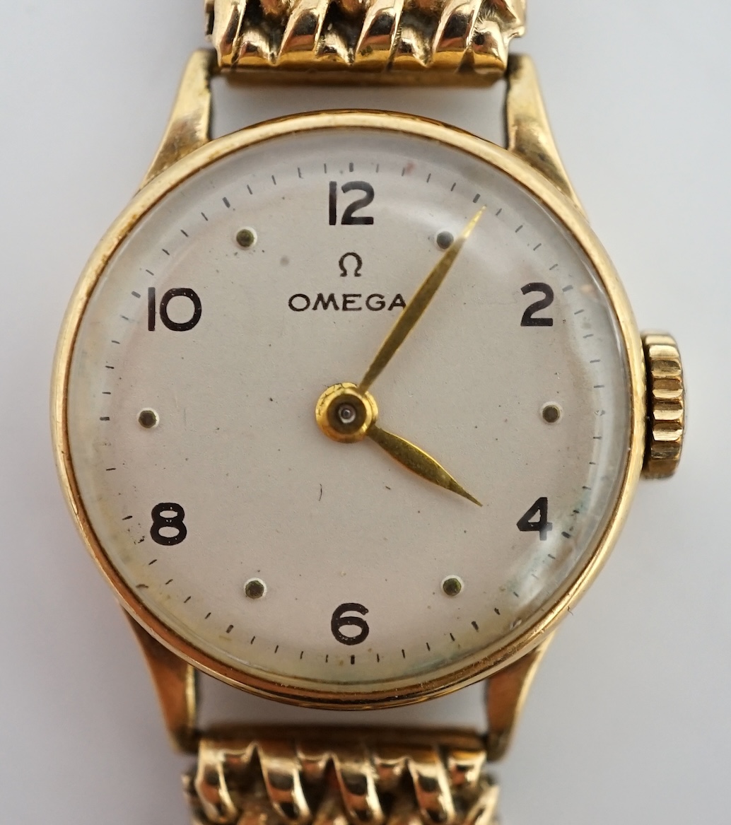 A lady's 9ct gold Omega manual wind wrist watch, on an associated 9ct bracelet, with Arabic and dot numerals, case diameter 20mm, overall length 16.7cm, gross weight 30 grams., no box or papers, with spare bracelet parts